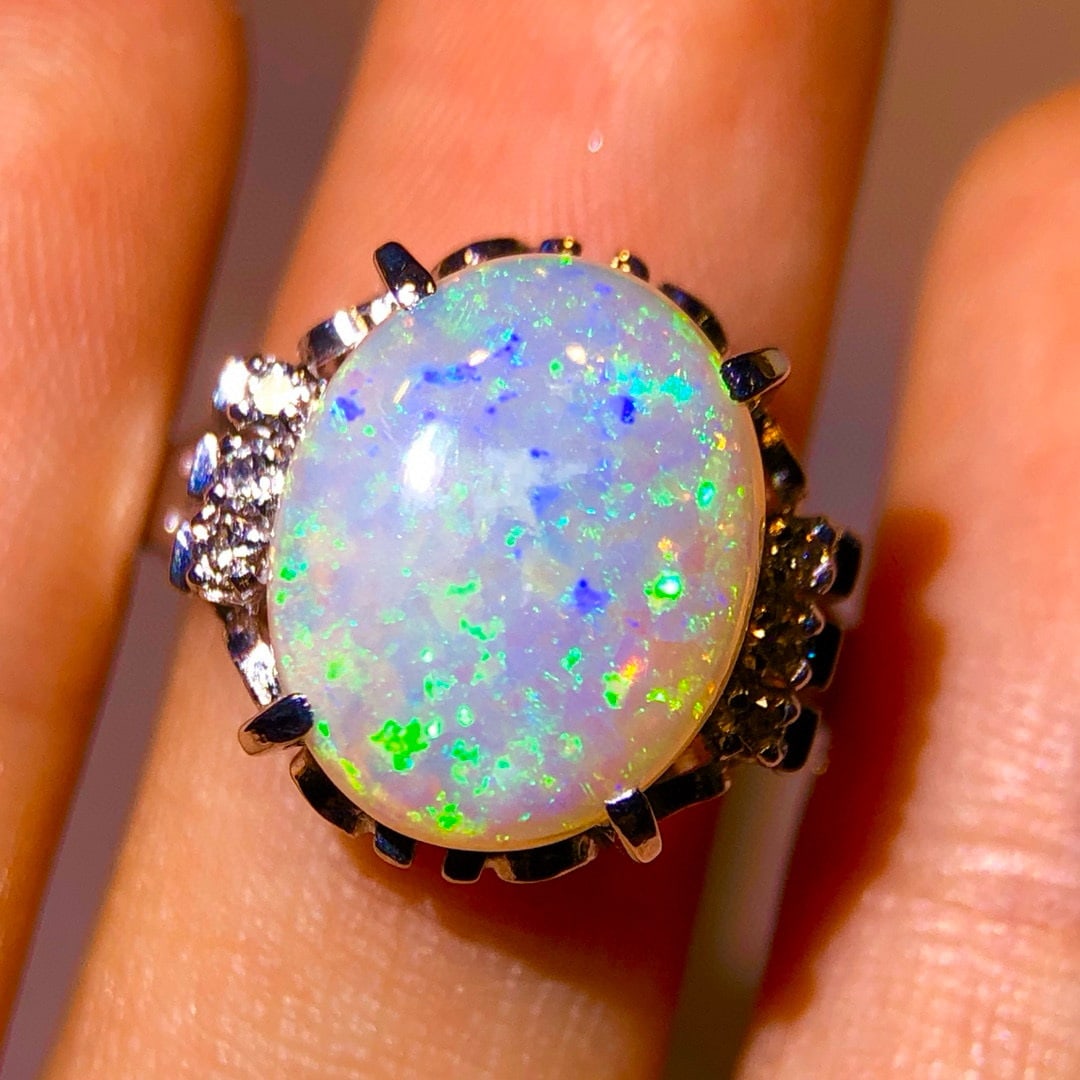 14k Gold 3.38 Ctw Natural Opal & Diamond Ring: Ref:230992182 // gold content:14k gold // ring size:7. 25us // // main gemstone:opal // shape:oval // carat weight:3. 28ct // color:color // treatment:natural // // adjacent gemstone 2 : diamond //