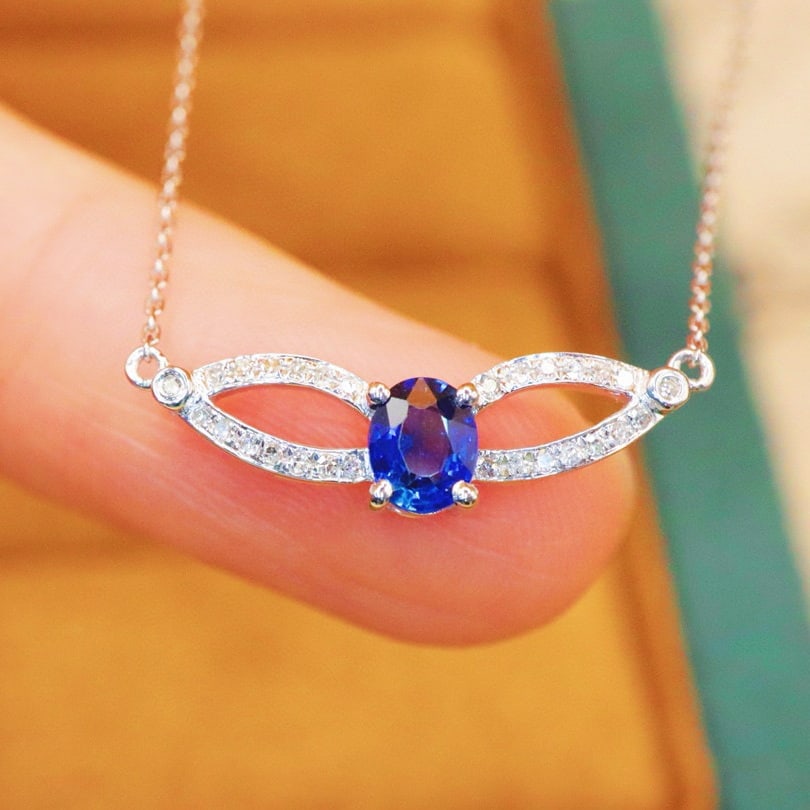 14k Gold 0.52 Ctw Natural Sapphire & Diamond Necklace: Ref:230992184 // gold content:14k gold // main gemstone:sapphire // shape:oval // carat weight:0. 43ct // color:blue // treatment:natural // // adjacent gemstone 2 : diamond // number of stones:30 //