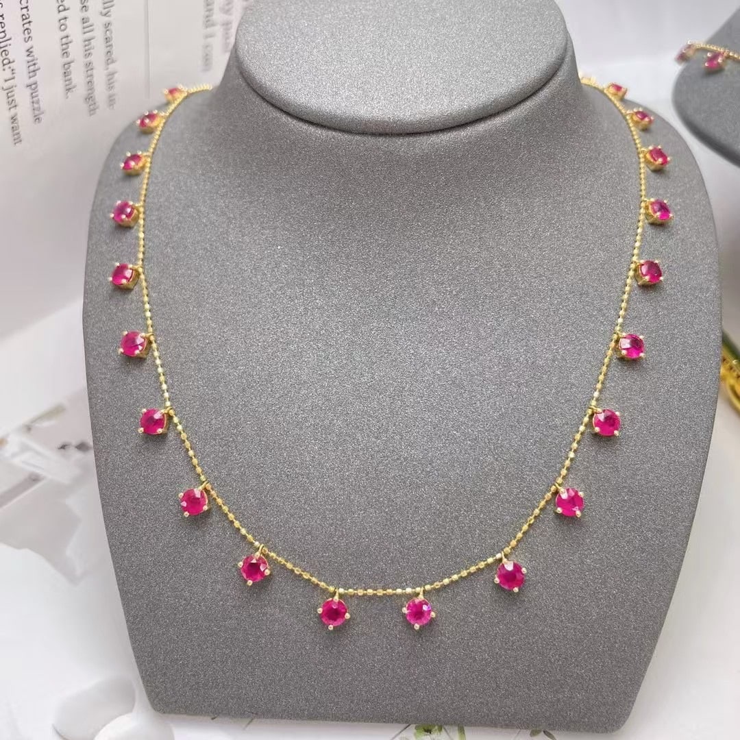 14k Gold 5.17 Ct Natural Ruby Necklace: Ref:230992222 // gold content:14k gold // main gemstone:ruby // shape:round // carat weight:5. 17ct // color:red // treatment:natural // cut grade:g // Condition: New Low Estimate: 5700.00 High