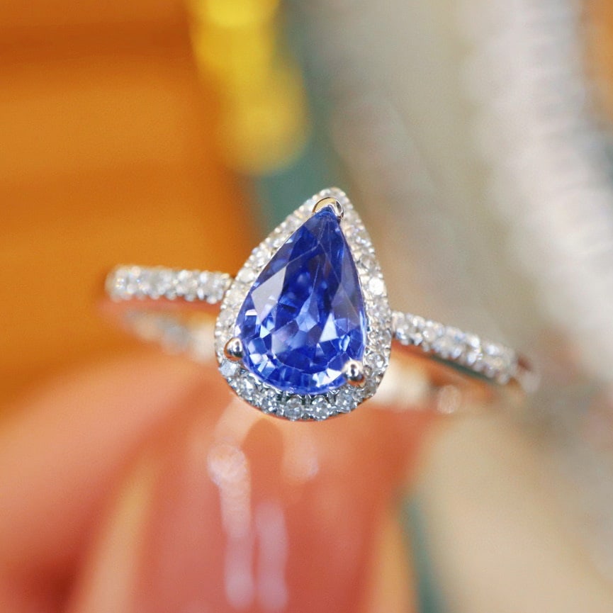 14k Gold 1.40 Ctw Natural Sapphire & Diamond Ring: Ref:230992352 // gold content:14k gold // ring size:7. 25us // // main gemstone:sapphire // shape:pear // carat weight:1. 29ct // color:blue // treatment:natural // // adjacent gemstone 2 : diamond //