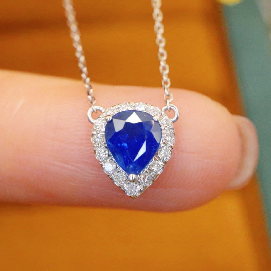 14k Gold 1.09 Ctw Natural Sapphire & Diamond Necklace: Ref:230992362 // gold content:14k gold // main gemstone:sapphire // shape:pear // carat weight:0. 93ct // color:blue // treatment:natural // // adjacent gemstone 2 : diamond // number of stones:16 //