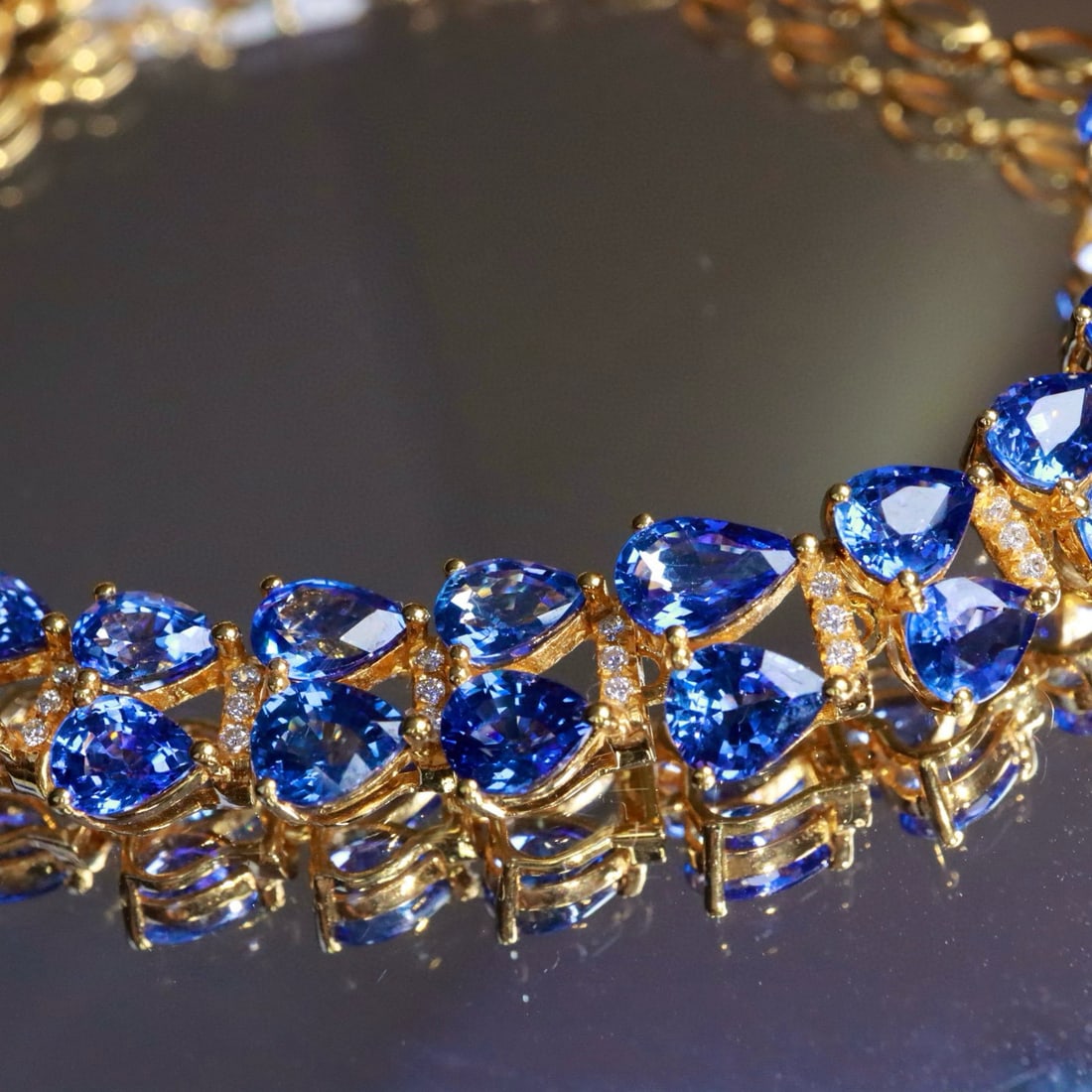 14k Gold 9.13 Ctw Natural Sapphire & Diamond Bracelet: Ref:230992424 // gold content:14k gold // main gemstone:sapphire // shape:pear // carat weight:9ct // color:cornflower blue // treatment:natural // // adjacent gemstone 2 : diamond // shape:round //