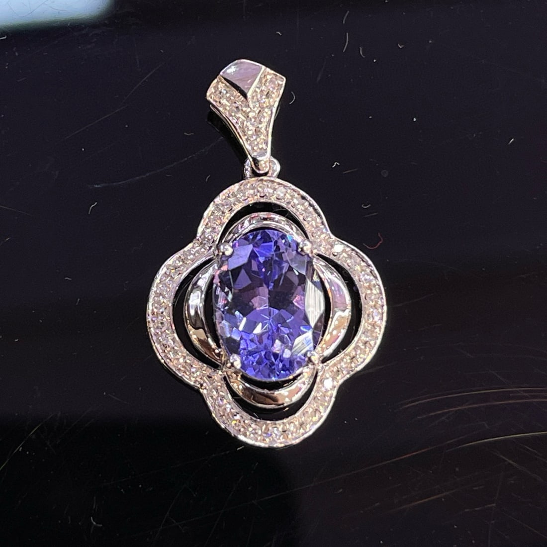 14k Gold 1.22 Ct Natural Tanzanite & Diamond Pendant( Without Chain ): Ref:230992433 // gold content:14k gold // main gemstone:tanzanite // shape:oval // carat weight:1. 22ct // color:blue // treatment:natural // // adjacent gemstone 2 : diamond // number of stones:40
