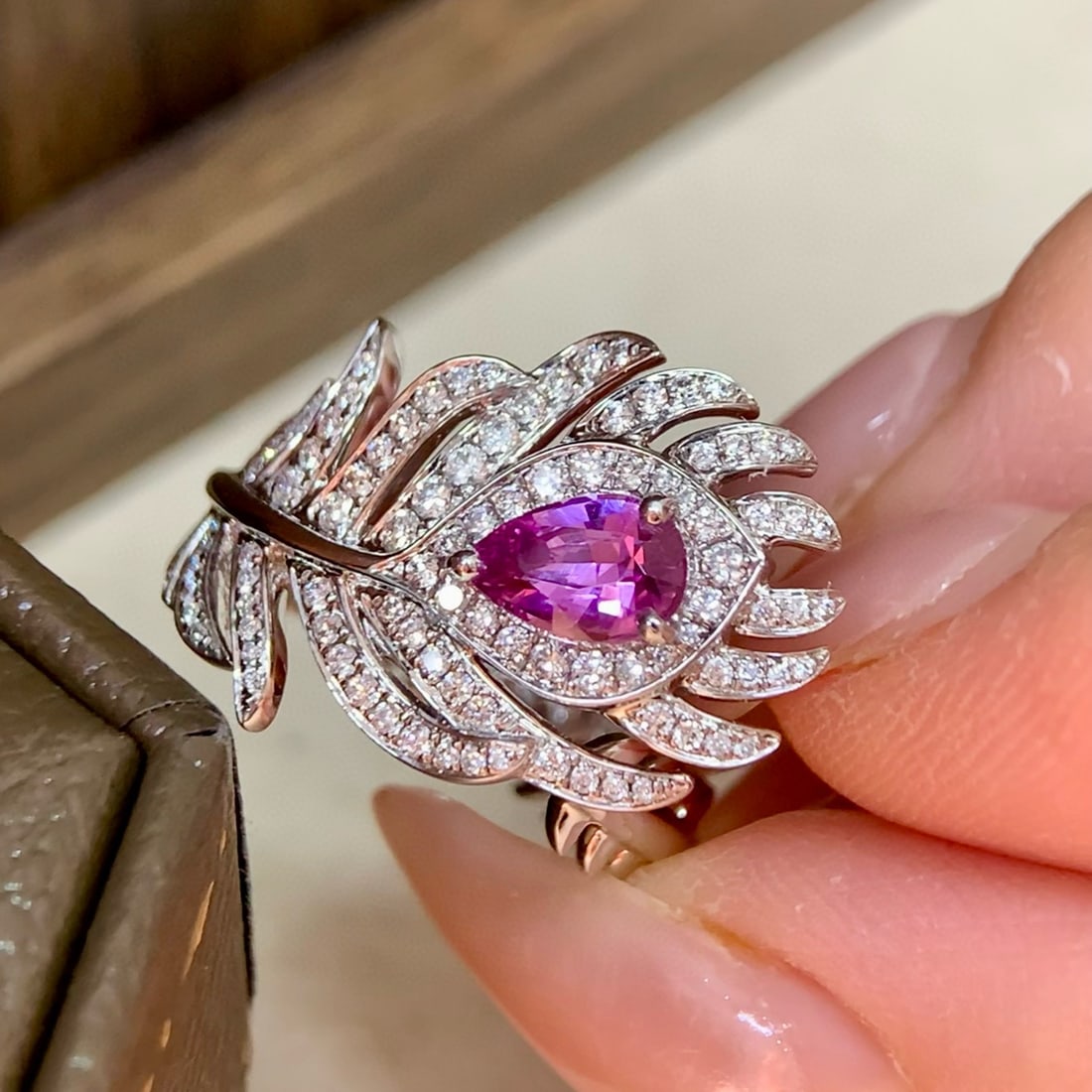 14k Gold 1.25 Ctw Natural Padparadscha Sapphire & Diamond Ring: Ref:230992435 // gold content:14k gold // ring size:7. 25us // // main gemstone:padparadscha sapphire // shape:pear // carat weight:0. 83ct // color:orangish pink // treatment:natural // // adjacent