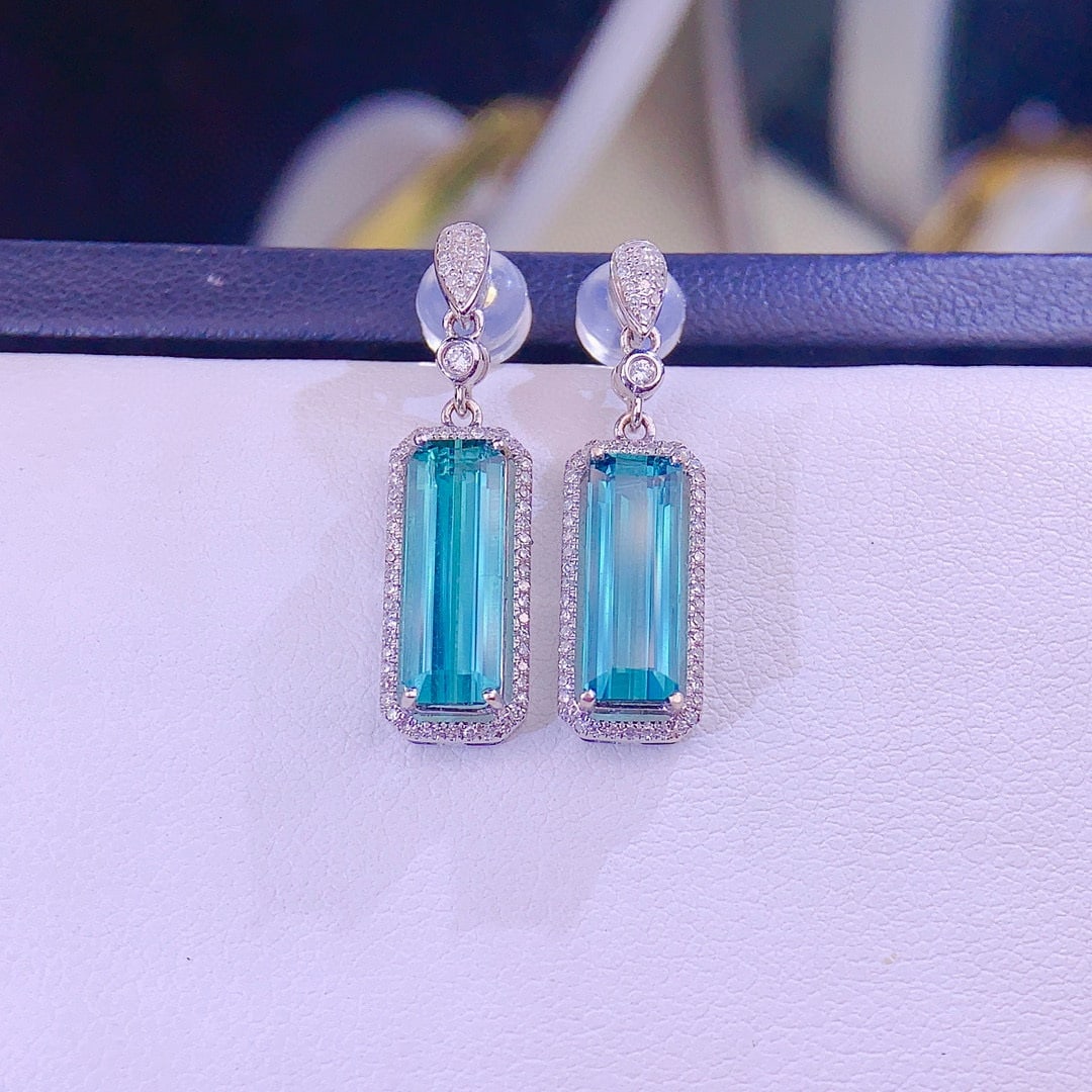 14k Gold 4.2 Ct Natural Tourmaline & Diamond Earrings: Ref:230993009 // gold content:14k gold // main gemstone:tourmaline // shape:octagonal // carat weight:4. 2ct // color:blue // treatment:natural // // adjacent gemstone 2 : diamond // shape:round //