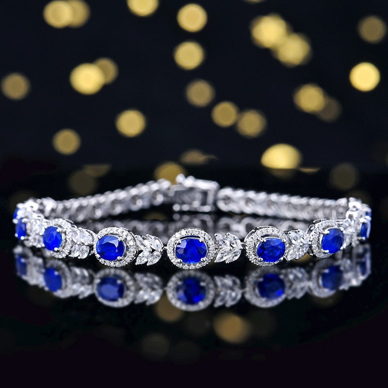 14k Gold 4.36 Ctw Vivid Blue Natural Sapphire & Diamond Bracelet: Ref:230993043 // gold content:14k gold // main gemstone:sapphire // shape:oval // carat weight:3. 91ct // color:vivid blue // treatment:natural // // adjacent gemstone 2 : diamond // number of stones: