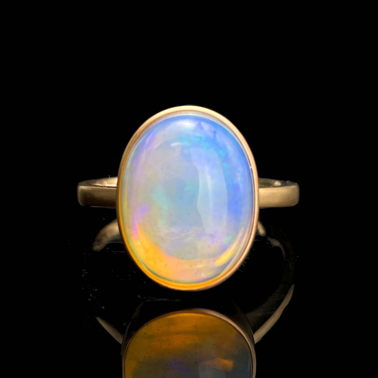 14k Gold 4.2 Ct Natural Opal Ring: Ref:230993064 // gold content:14k gold // ring size:7. 25us // // main gemstone:opal // shape:oval // carat weight:4. 2ct // color:color // treatment:natural // Condition: New Low Estimate: 1100 High