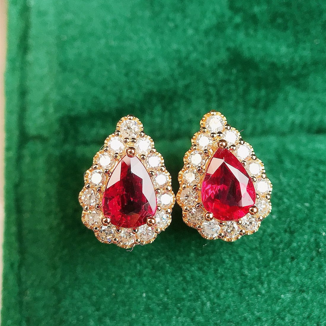 14k Gold 1.09 Ctw Vivid Red Natural Ruby & Diamond Earrings: Ref:230993081 // gold content:14k gold // main gemstone:ruby // shape:pear // carat weight:0. 77ct // color:vivid red // treatment:natural // // adjacent gemstone 2 : diamond // shape:round // carat w
