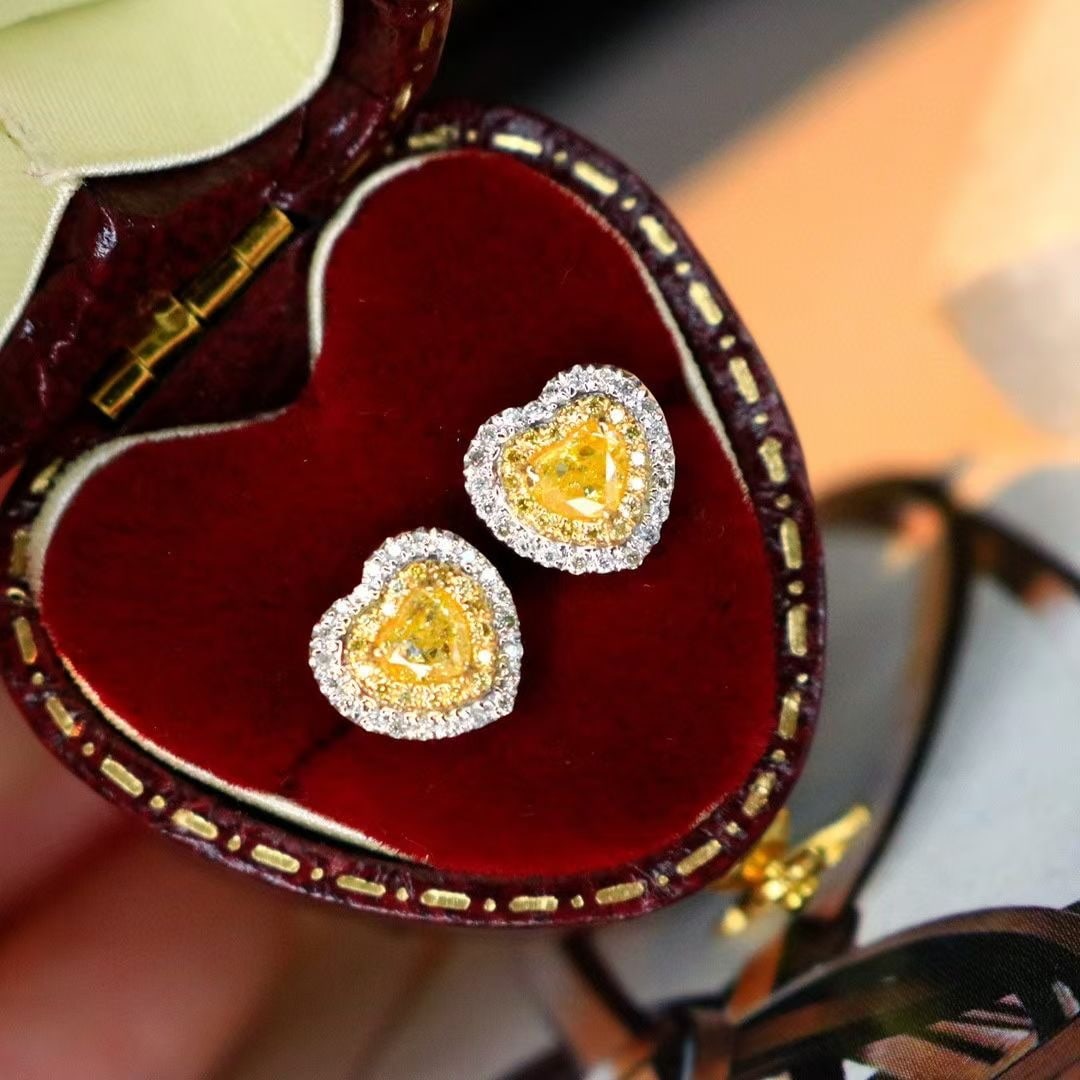 14k Gold 0.56 Ctw Natural Yellow Diamond & Diamond Earrings: Ref:230993104 // gold content:14k gold // main gemstone:yellow diamond // shape:heart // carat weight:0. 4ct // color:yellow // treatment:natural // // adjacent gemstone 2 : diamond // shape:round //