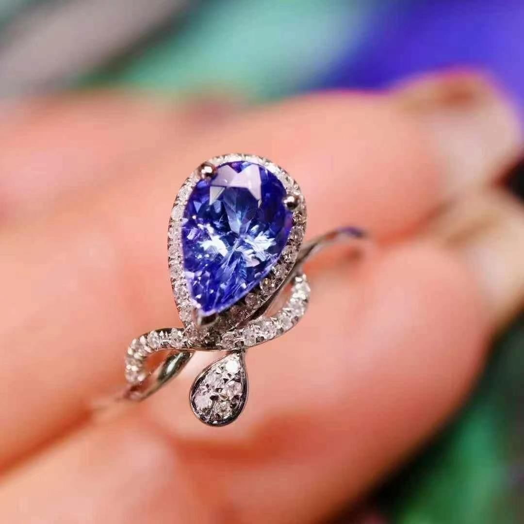 14k Gold 1 Ct Natural Tanzanite & Diamond Ring: Ref:230993109 // gold content:14k gold // ring size:7. 25us // // main gemstone:tanzanite // shape:pear // carat weight:1ct // color:blue // treatment:natural // // adjacent gemstone 2 : diamond //