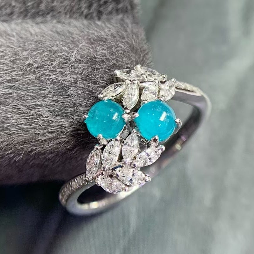 14k Gold 1.12 Ctw Natural Paraiba Tourmaline & Diamond Ring: Ref:230993129 // gold content:14k gold // ring size:7. 25us // // main gemstone:paraiba tourmaline // shape:round // carat weight:0. 58ct // color:blue // treatment:natural // cut grade:g // // adjace