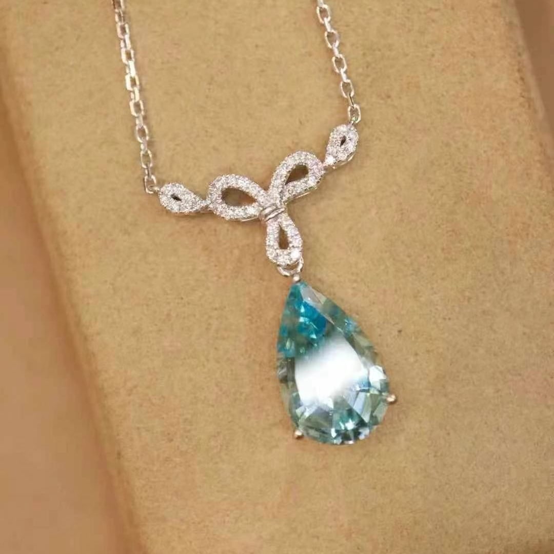 14k Gold 2.49 Ctw Natural Aquamarine & Diamond Necklace: Ref:230993169 // gold content:14k gold // main gemstone:aquamarine // shape:pear // carat weight:2. 36ct // color:santa maria color // treatment:natural // // adjacent gemstone 2 : diamond //