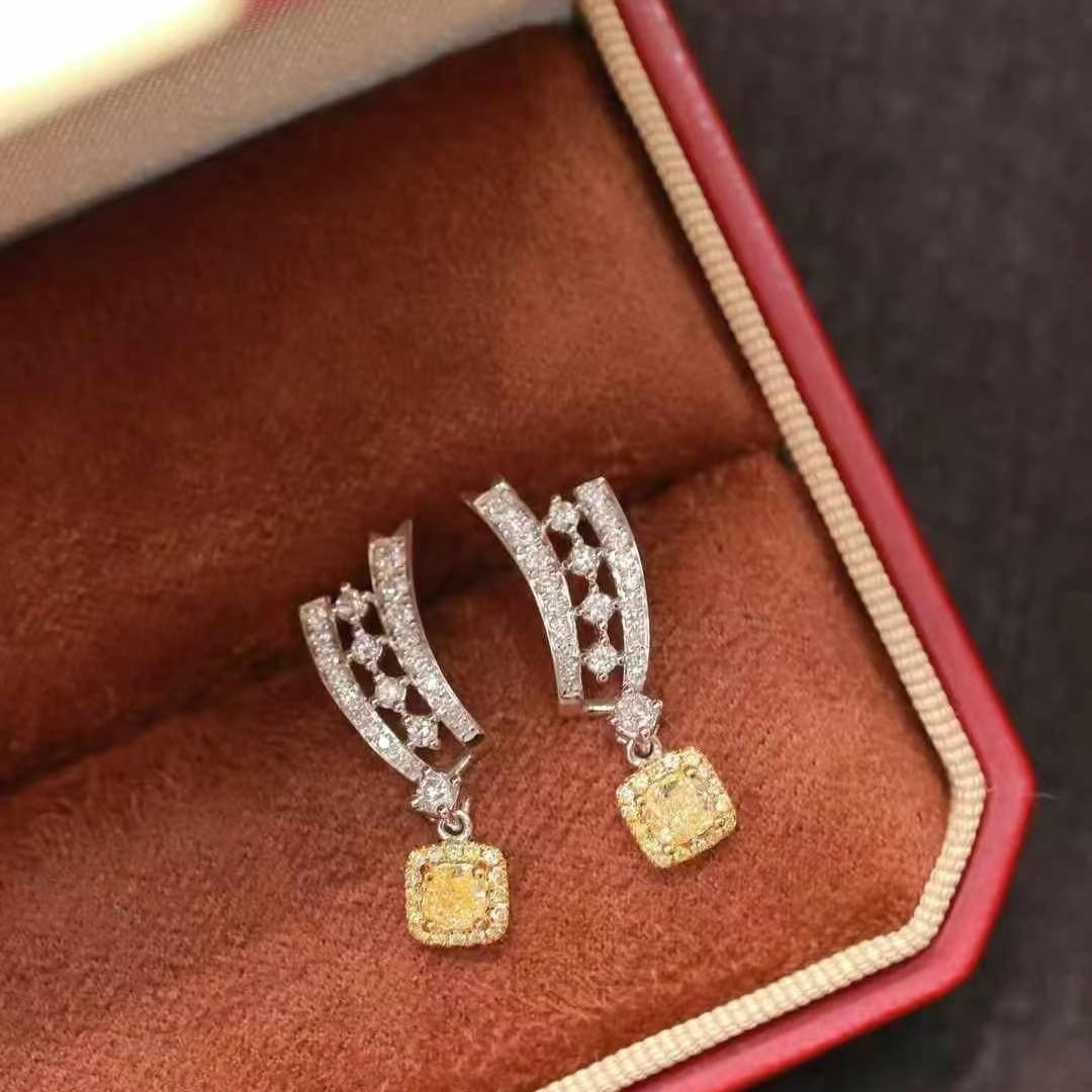 14k Gold 0.63 Ct Natural Color Diamond Earrings: Ref:230993182 // gold content:14k gold // main gemstone:diamond // shape:multiply // carat weight:0. 63ct // clarity grade:vs-si // color:color // treatment:natural // High Estimate: 6600 Low Estimate