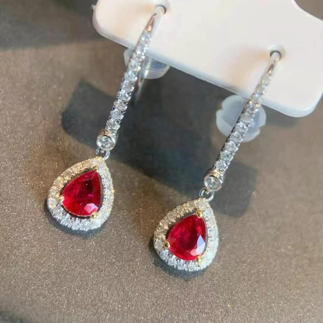 14k Gold 1.20 Ctw Vivid Red Natural Ruby & Diamond Earrings: Ref:230993197 // gold content:14k gold // main gemstone:ruby // shape:pear // carat weight:0. 85ct // color:vivid red // treatment:natural // // adjacent gemstone 2 : diamond // shape:round // carat