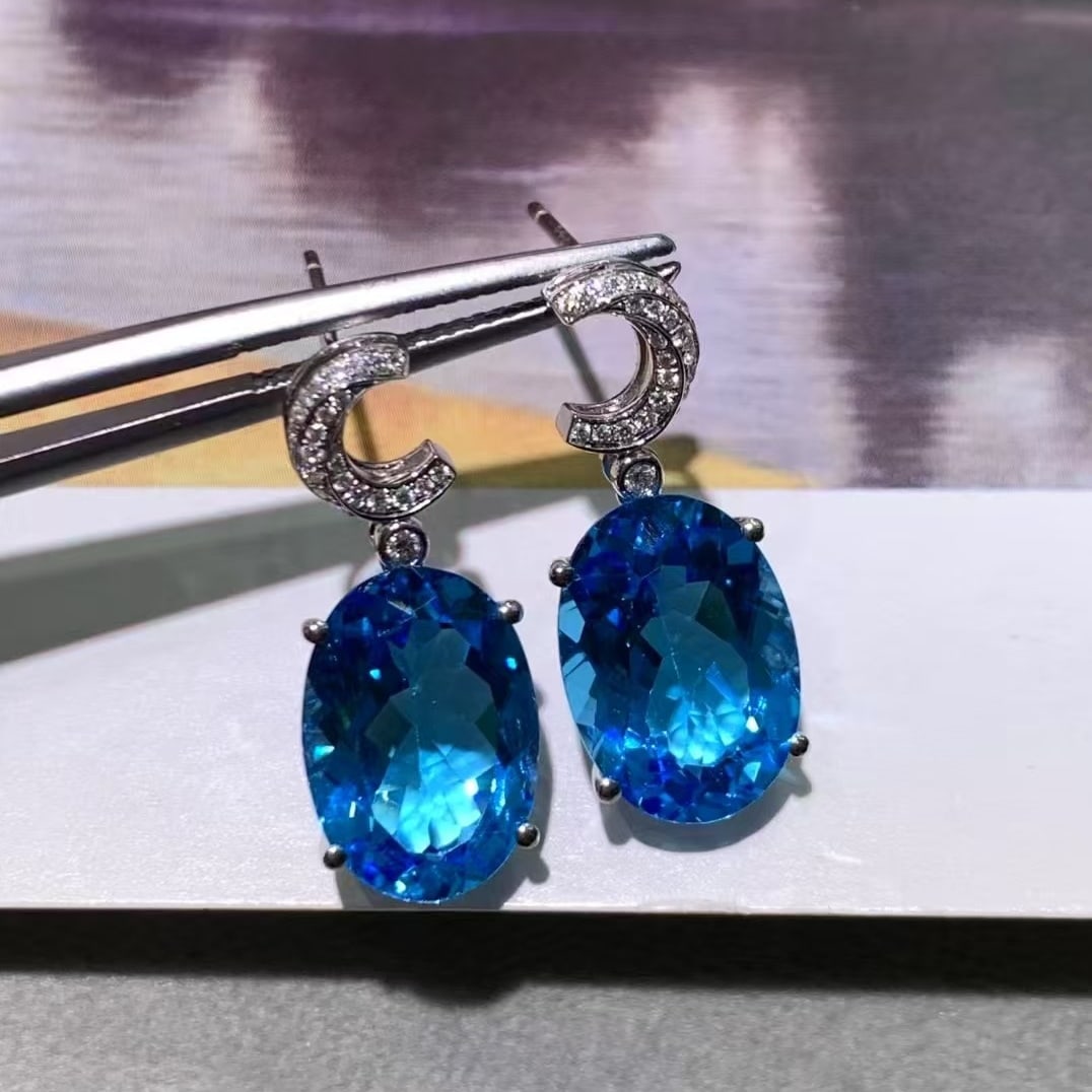 14k Gold 12.34 Ctw Natural Topaz & Diamond Earrings: Ref:230993203 // gold content:14k gold // main gemstone:topaz // shape:round // carat weight:12. 2ct // color:blue // treatment:natural // cut grade:g // // adjacent gemstone 2 : diamond // number of 