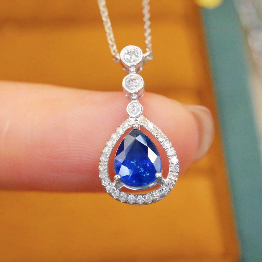 14k Gold 0.97 Ctw Vivid Blue Natural Sapphire & Diamond Necklace: Ref:230993223 // gold content:14k gold // main gemstone:sapphire // shape:pear // carat weight:0. 83ct // color:vivid blue // treatment:natural // // adjacent gemstone 2 : diamond // number of stones: