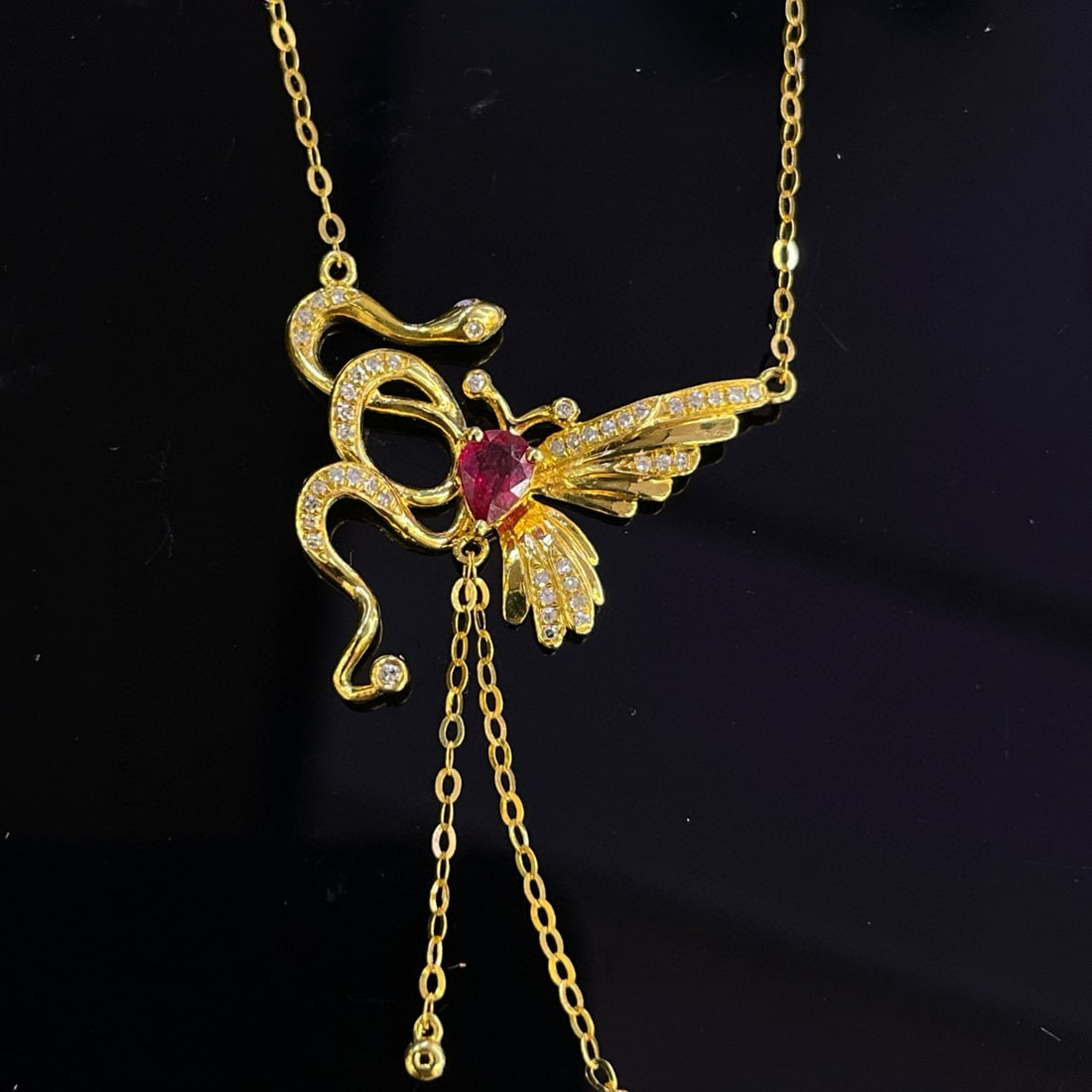 14k Gold 0.22 Ct Natural Ruby & Diamond Necklace: Ref:230994022 // gold content:14k gold // main gemstone:ruby // shape:pear // carat weight:0. 22ct // color:red // treatment:natural // // adjacent gemstone 2 : diamond // number of stones:45 //
