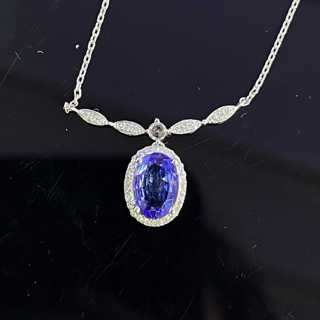14k Gold 1.00 Ct Natural Tanzanite & Diamond & Sapphire Necklace: Ref:230994086 // gold content:14k gold // main gemstone:tanzanite // shape:oval // carat weight:1. 00ct // color:blue // treatment:natural // // adjacent gemstone 2 : diamond // number of stones:38