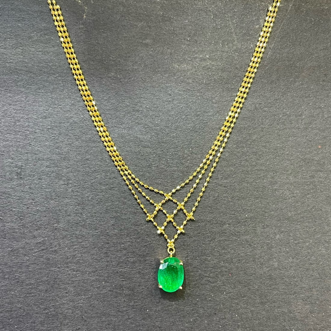 14k Gold 1.5 Ct Vivid Green Natural Emerald Necklace: Ref:230994128 // gold content:14k gold // main gemstone:emerald // shape:oval // carat weight:1. 5ct // color:vivid green // treatment:natural // Condition: New Low Estimate: 4000 High Estimate: 5900