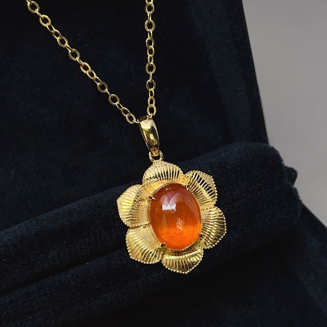 14k Gold 6.35 Ct Natural Spessartine Pendant( Without Chain ): Ref:230994161 // gold content:14k gold // main gemstone:spessartine // shape:oval // carat weight:6. 35ct // color:orange // treatment:natural // Low Estimate: 2400 Condition: New High Estimate: 3600
