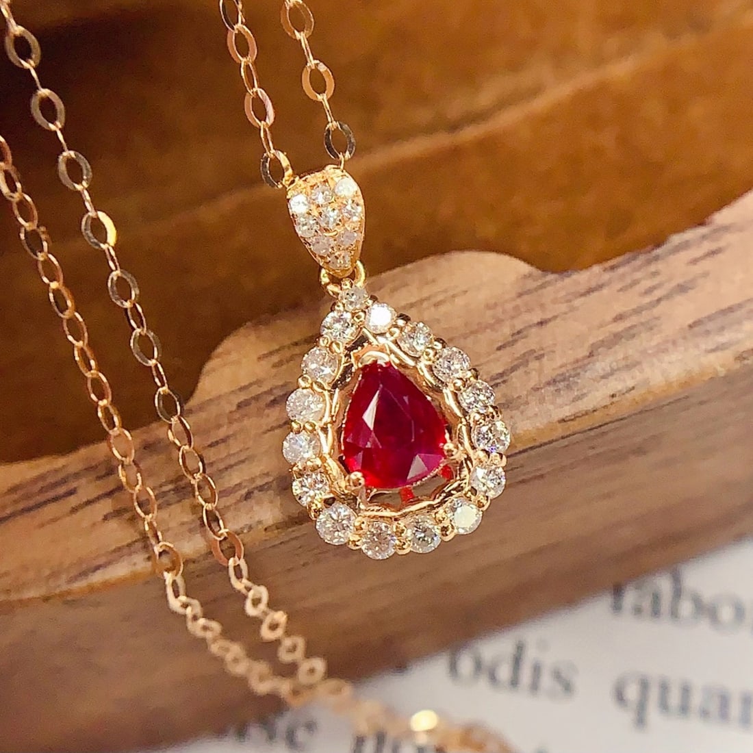 14k Gold 0.4 Ct Natural Ruby & Diamond Necklace: Ref:230994197 // gold content:14k gold // main gemstone:ruby // shape:pear // carat weight:0. 4ct // color:red // treatment:natural // // adjacent gemstone 2 : diamond // number of stones:25 //