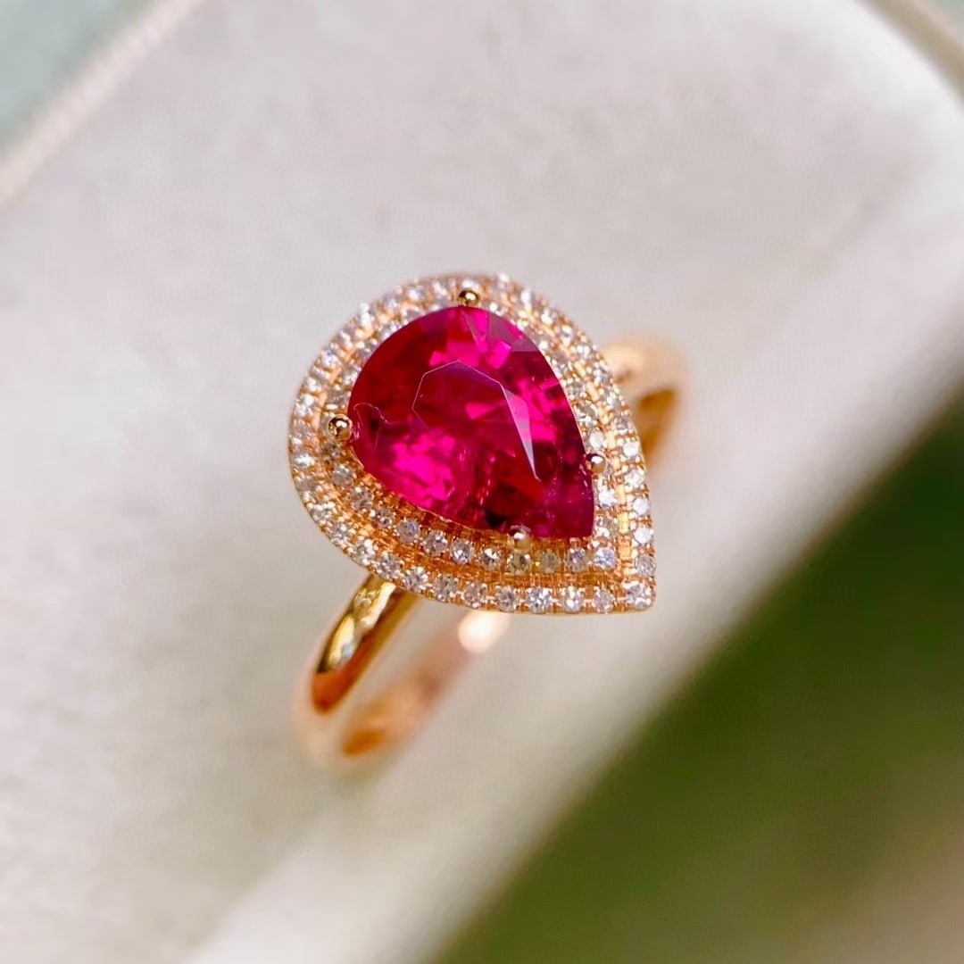 14k Gold 1.40 Ctw Natural Tourmaline & Diamond Ring: Ref:230994201 // gold content:14k gold // ring size:7. 25us // // main gemstone:tourmaline // shape:pear // carat weight:1. 19ct // color:red // treatment:natural // // adjacent gemstone 2 : diamond /