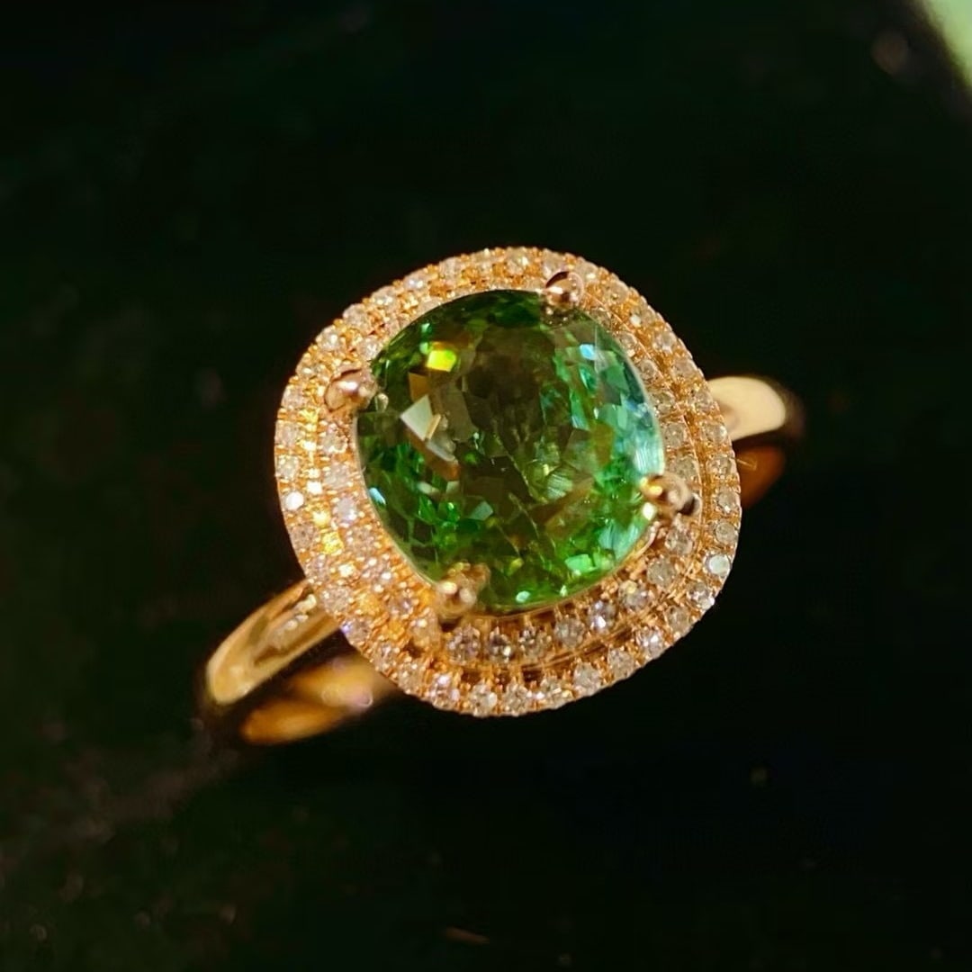 14k Gold 2.74 Ctw Natural Tourmaline & Diamond Ring: Ref:230994202 // gold content:14k gold // ring size:7. 25us // // main gemstone:tourmaline // shape:oval // carat weight:2. 53ct // color:green // treatment:natural // // adjacent gemstone 2 : diamond