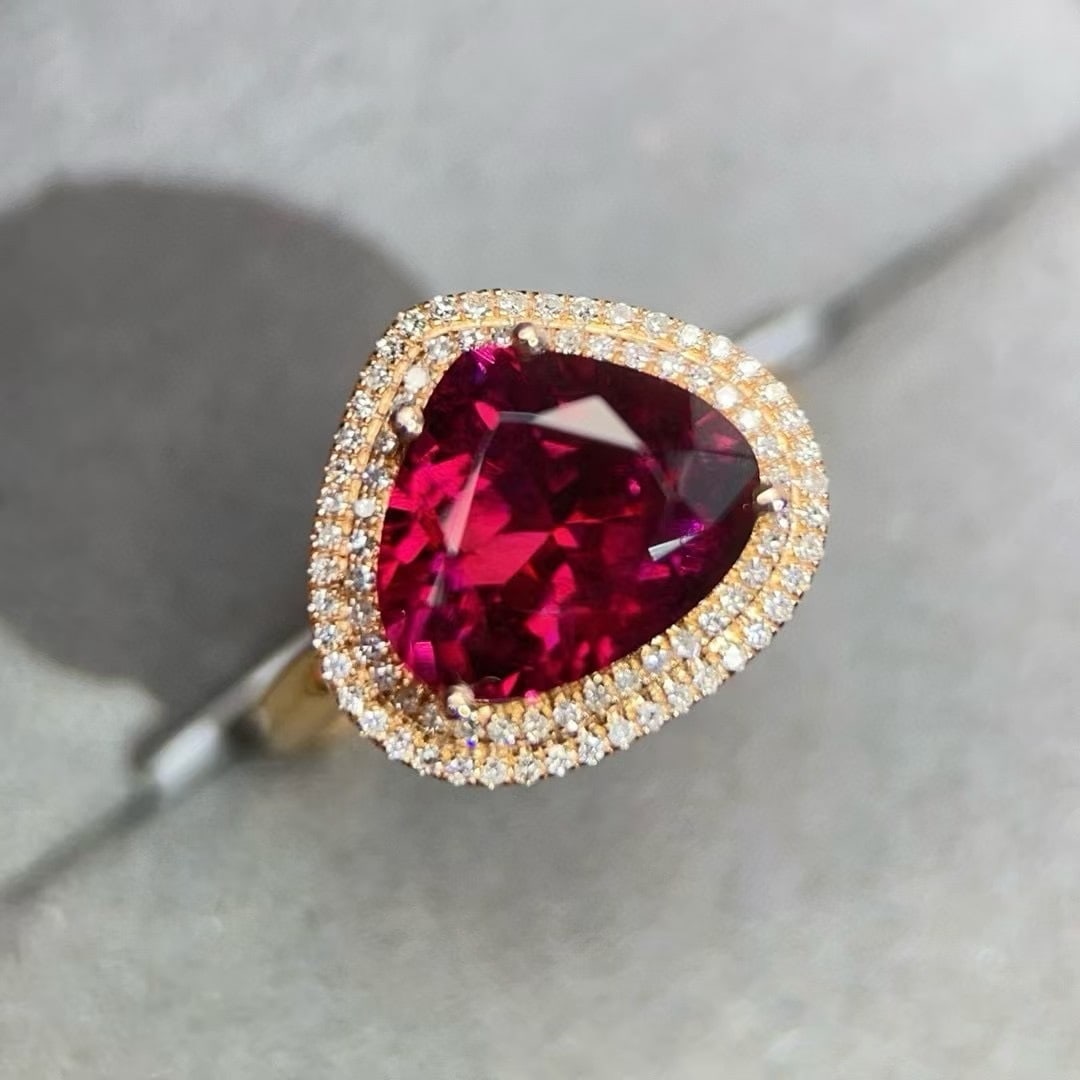 14k Gold 3.75 Ctw Natural Tourmaline & Diamond Ring: Ref:230994205 // gold content:14k gold // ring size:7. 25us // // main gemstone:tourmaline // shape:pear // carat weight:3. 5ct // color:red // treatment:natural // // adjacent gemstone 2 : diamond