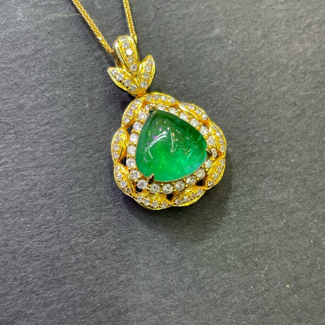 14k Gold 2.9 Ct Natural Emerald & Diamond Pendant( Without Chain ): Ref:230994282 // gold content:14k gold // main gemstone:emerald // shape:pear // carat weight:2. 9ct // color:green // treatment:natural // // adjacent gemstone 2 : diamond // number of stones:70 //