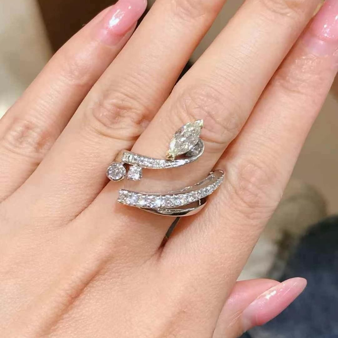 14k Gold 1.26 Ctw Natural H Diamond Ring: Ref:230994290 // gold content:14k gold // ring size:7. 25us // // main gemstone:diamond // shape:marquise // carat weight:0. 63ct // clarity grade:vs-si // color:h // treatment:natural // // adjacent 