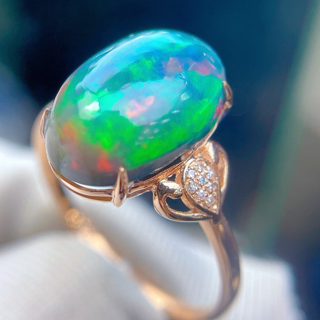 14k Gold 3.7 Ct Natural Opal & Diamond Ring: Ref:230994395 // gold content:14k gold // ring size:7. 25us // // main gemstone:opal // shape:oval // carat weight:3. 7ct // color:color // treatment:natural // // adjacent gemstone 2 : diamond // sha