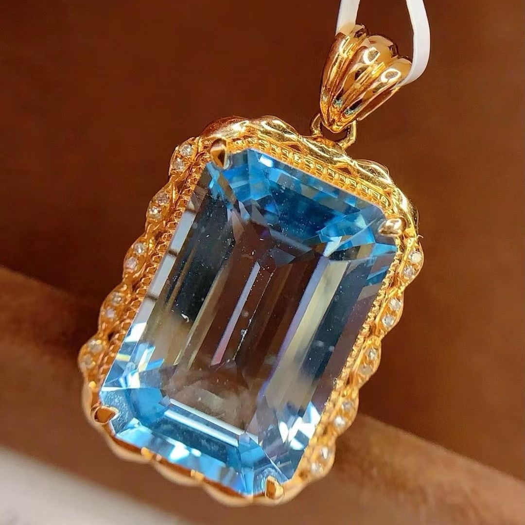 14k Gold 13.1 Ct Natural Topaz & Diamond Pendant( Without Chain ): Ref:230994430 // gold content:14k gold // main gemstone:topaz // shape:octagonal // carat weight:13. 1ct // color:blue // treatment:natural // // adjacent gemstone 2 : diamond // number of stones:20