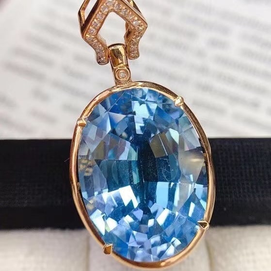 14k Gold 19.15 Ct Natural Topaz & Diamond Pendant( Without Chain ): Ref:230994431 // gold content:14k gold // main gemstone:topaz // shape:oval // carat weight:19. 15ct // color:blue // treatment:natural // // adjacent gemstone 2 : diamond // number of stones:20 //