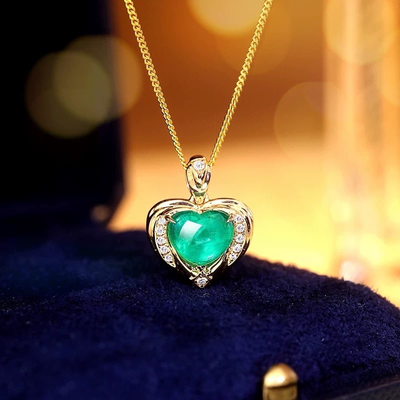 14k Gold 1.40 Ctw Natural Emerald & Diamond Pendant( Without Chain ): Ref:230995019 // gold content:14k gold // main gemstone:emerald // shape:heart // carat weight:1. 34ct // color:green // treatment:natural // // adjacent gemstone 2 : diamond // shape:round // carat w