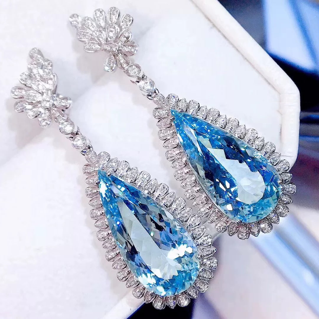 14k Gold 16.3 Ct Natural Aquamarine & Diamond Earrings: Ref:230995040 // gold content:14k gold // main gemstone:aquamarine // shape:pear // carat weight:16. 3ct // color:blue // treatment:natural // // adjacent gemstone 2 : diamond // shape:round // clarit