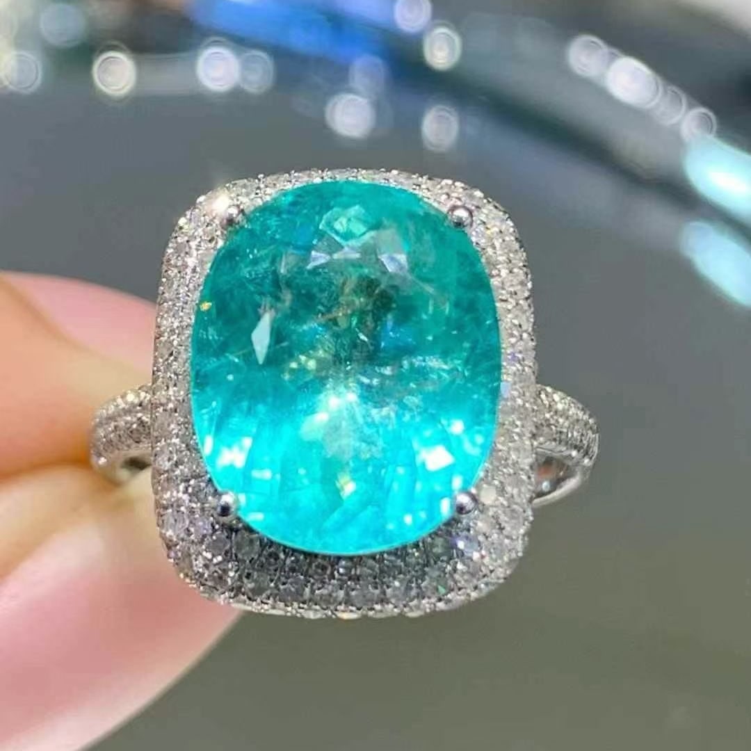 14k Gold 6 Ct Natural Paraiba Tourmaline & Diamond Ring: Ref:230995046 // gold content:14k gold // ring size:7. 25us // // main gemstone:paraiba tourmaline // shape:oval // carat weight:6ct // color:neon blue // treatment:natural // // adjacent gemstone 2 :