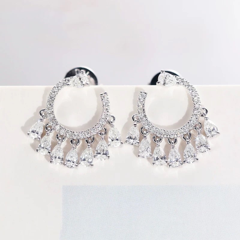14k Gold 0.58 Ct Natural H Diamond Earrings: Ref:230995049 // gold content:14k gold // main gemstone:diamond // shape:pear & round // carat weight:0. 58ct // clarity grade:vs-si // color:h // treatment:natural // Condition: New Low Estimate: