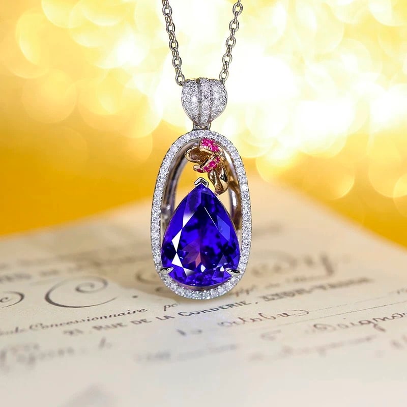 14k Gold 6.57 Ctw Natural Tanzanite & Diamond Pendant( Without Chain ): Ref:230995062 // gold content:14k gold // main gemstone:tanzanite // shape:pear // carat weight:5. 99ct // color:blue // treatment:natural // // adjacent gemstone 2 : diamond // shape:round // carat