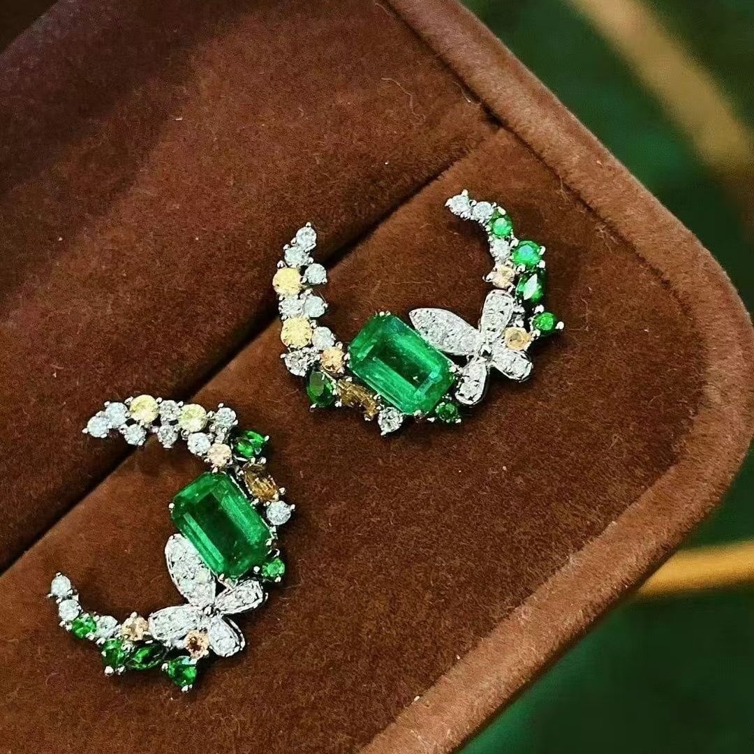 14k Gold 1.5 Ct Natural Emerald & Coloured Gemstone & Diamond Earrings: Ref:230995089 // gold content:14k gold // main gemstone:emerald // shape:octagonal // carat weight:1. 5ct // color:green // treatment:natural // // adjacent gemstone 2 : coloured gemstone // shape:mul