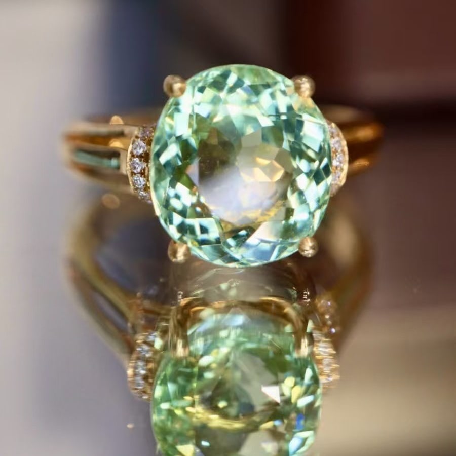 14k Gold 4.45 Ctw Natural Tourmaline & Diamond Ring: Ref:230995122 // gold content:14k gold // ring size:7. 25us // // main gemstone:tourmaline // shape:oval // carat weight:4. 41ct // color:green // treatment:natural // // adjacent gemstone 2 :