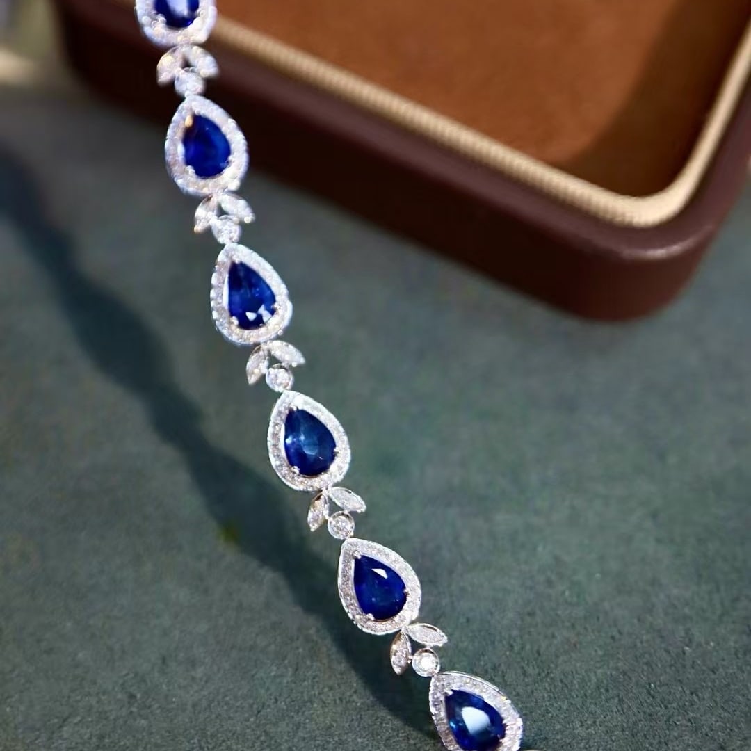 14k Gold 5.37 Ctw Natural Sapphire & Diamond Bracelet: Ref:230995125 // gold content:14k gold // main gemstone:sapphire // shape:pear // carat weight:4. 7ct // color:blue // treatment:natural // // adjacent gemstone 2 : diamond // shape:round // carat