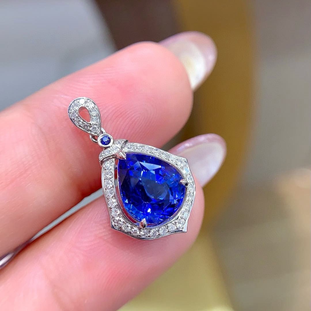 14k Gold 3.26 Ctw Natural Sapphire & Diamond Pendant( Without Chain ): Ref:230995174 // gold content:14k gold // main gemstone:sapphire // shape:pear // carat weight:3. 06ct // color:blue // treatment:natural // // adjacent gemstone 2 : diamond // shape:round // carat we