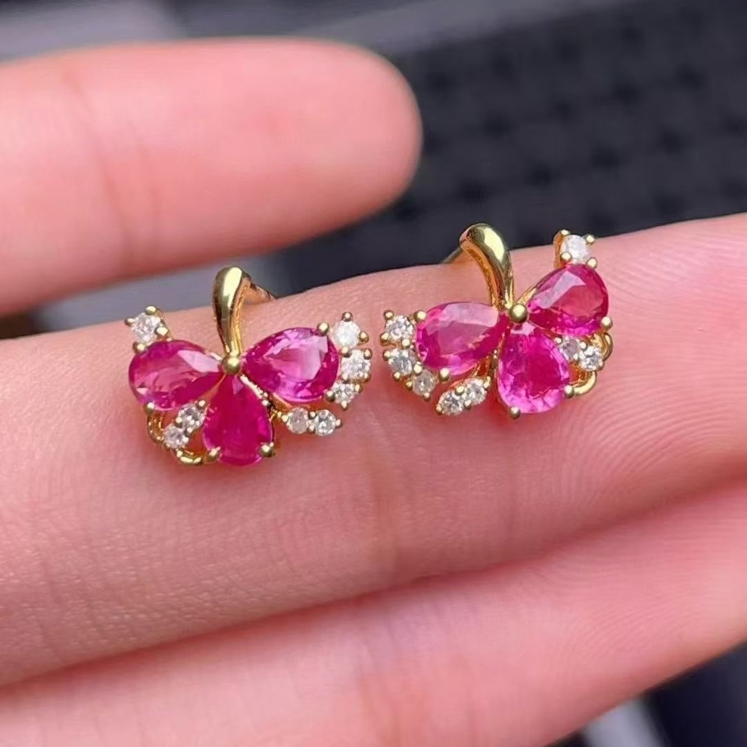 14k Gold 1.1 Ct Natural Ruby & Diamond Earrings: Ref:230995230 // gold content:14k gold // main gemstone:ruby // shape:pear // carat weight:1. 1ct // color:red // treatment:natural // // adjacent gemstone 2 : diamond // number of stones:14 //