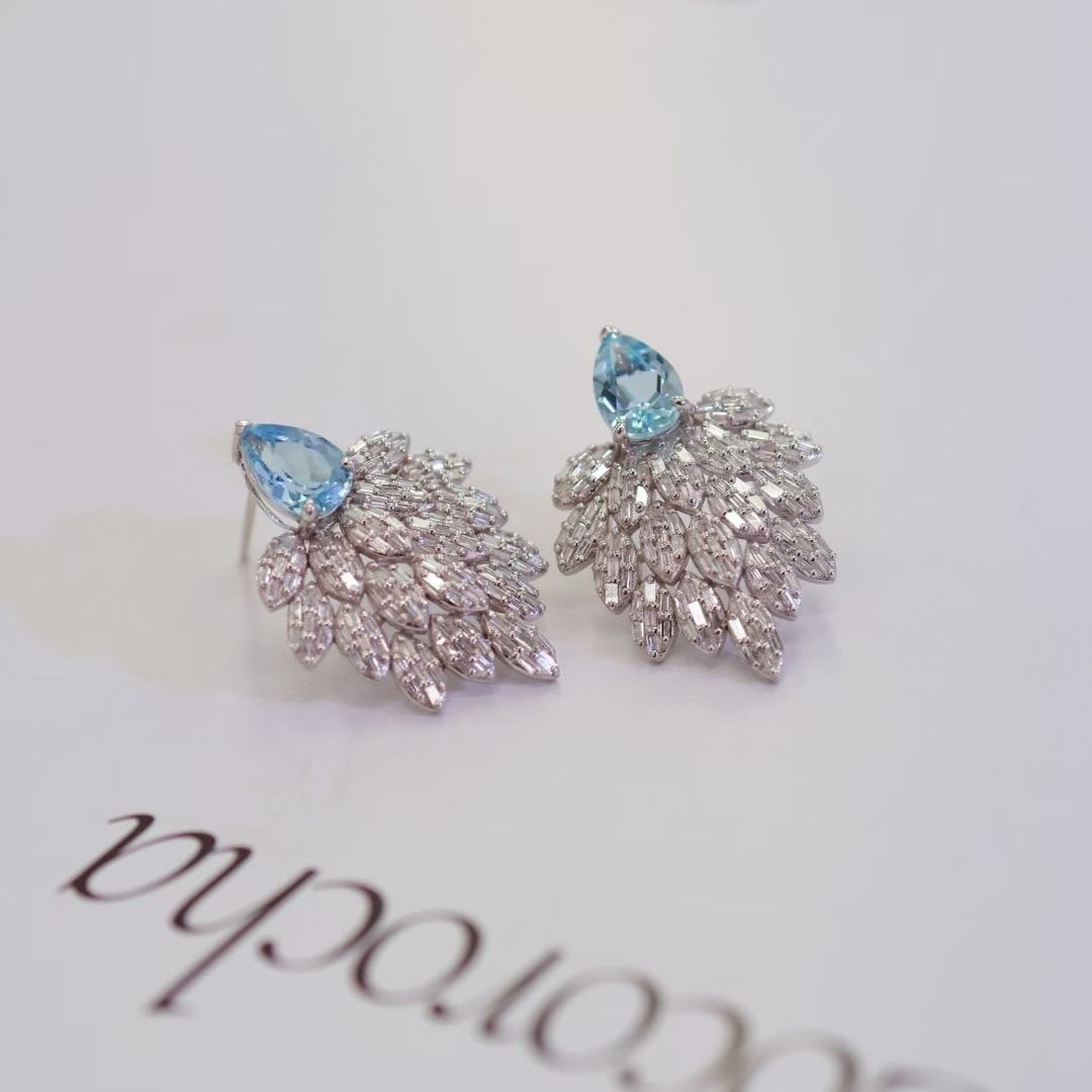 14k Gold 2.3 Ctw Natural Aquamarine & Diamond Earrings: Ref:230995257 // gold content:14k gold // main gemstone:aquamarine // shape:pear // carat weight:1. 3ct // color:blue // treatment:natural // // adjacent gemstone 2 : diamond // shape:baguette //