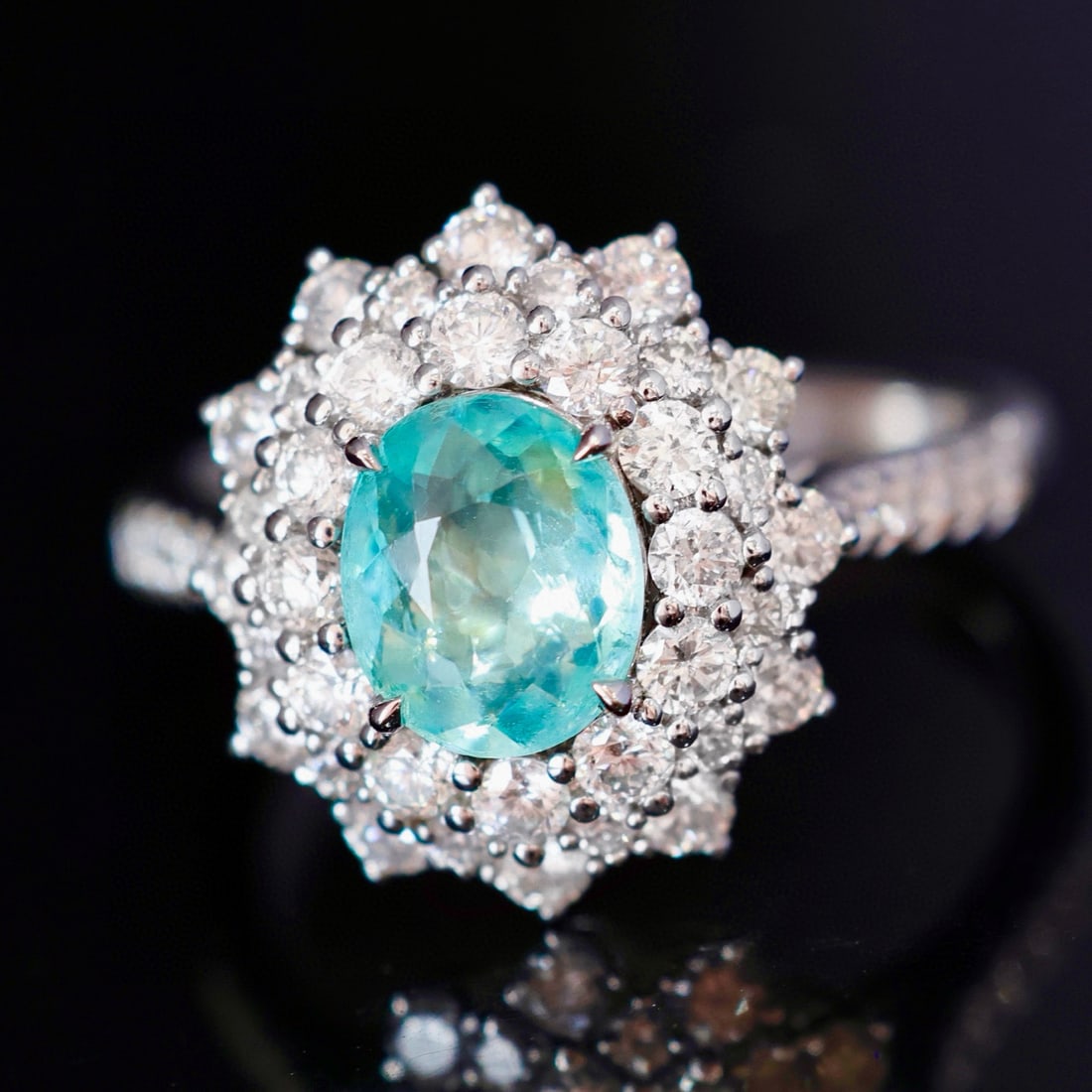 14k Gold 2.07 Ctw Natural Paraiba Tourmaline & Diamond Ring: Ref:230996048 // gold content:14k gold // ring size:7. 25us // // main gemstone:paraiba tourmaline // shape:oval // carat weight:0. 98ct // color:neon blue // treatment:natural // // adjacent