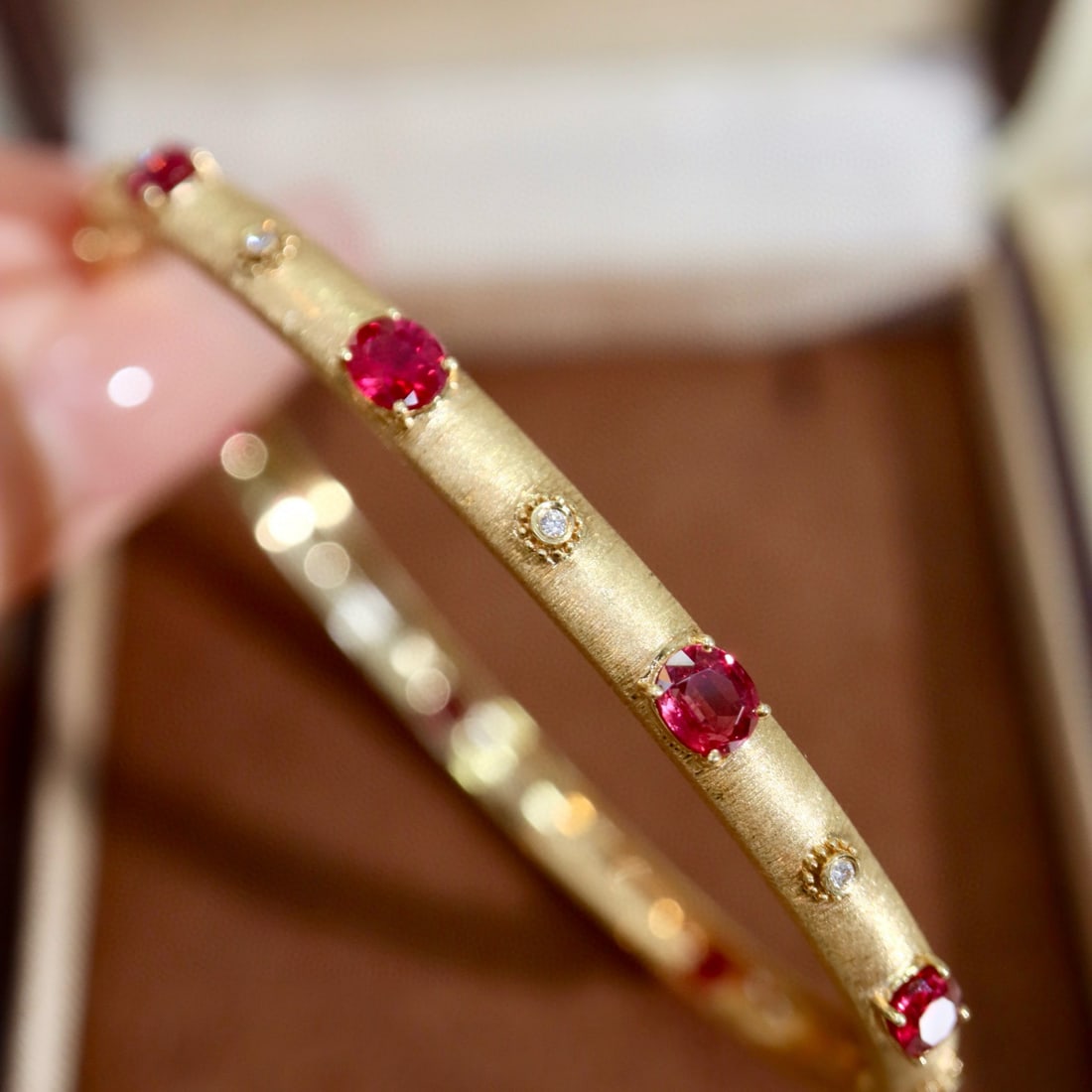 14k Gold 2.86 Ctw Natural Ruby & Diamond Bangle: Ref:230996058 // gold content:14k gold // main gemstone:ruby // shape:oval // carat weight:2. 8ct // color:red // treatment:natural // // adjacent gemstone 2 : diamond // shape:round // carat weight:0