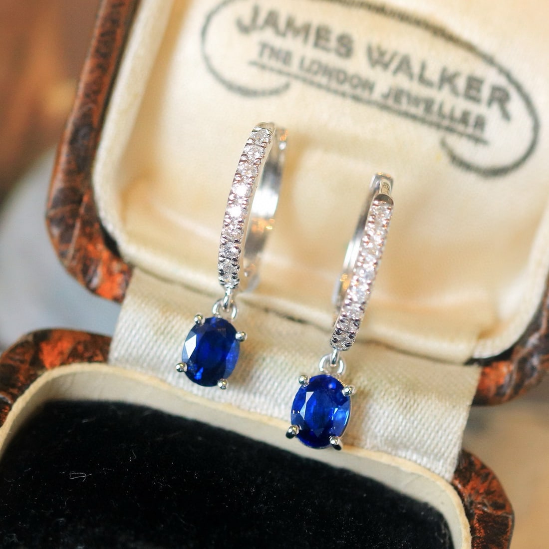 14k Gold 1.03 Ctw Natural Sapphire & Diamond Earrings: Ref:230996075 // gold content:14k gold // main gemstone:sapphire // shape:oval // carat weight:0. 85ct // color:royal blue // treatment:natural // // adjacent gemstone 2 : diamond // shape:round //