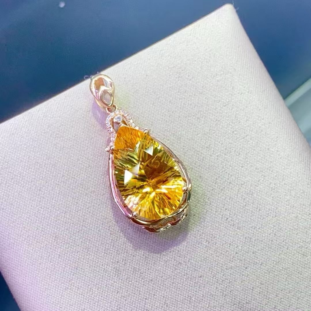 14k Gold 10.56 Ctw Natural Citrine & Diamond Pendant( Without Chain ): Ref:230996137 // gold content:14k gold // main gemstone:citrine // shape:pear // carat weight:10. 5ct // color:yellow // treatment:natural // // adjacent gemstone 2 : diamond // number of stones:19