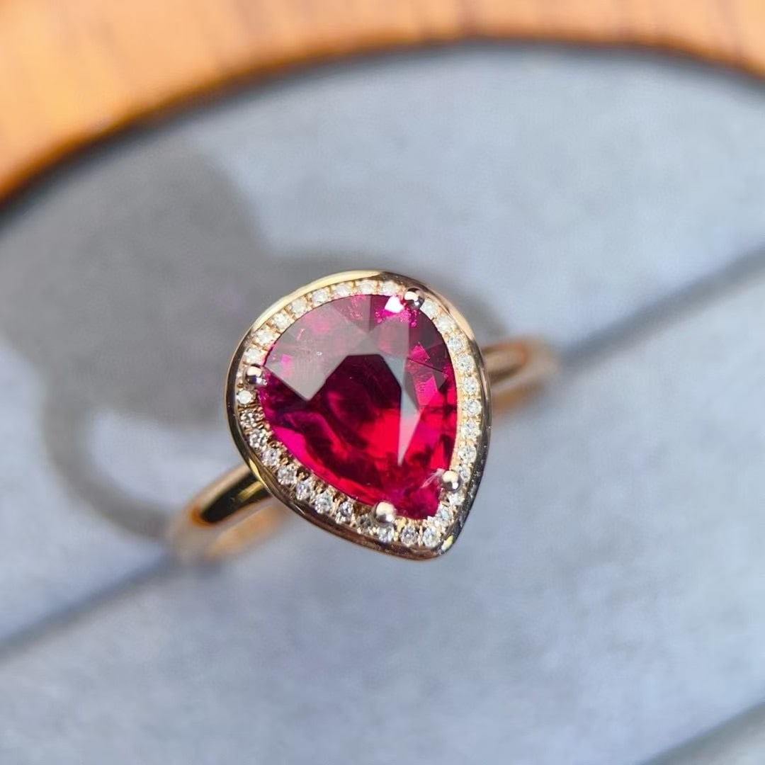 14k Gold 2.08 Ct Natural Tourmaline & Diamond Ring: Ref:230996168 // gold content:14k gold // ring size:7. 25us // // main gemstone:tourmaline // shape:pear // carat weight:2. 08ct // color:red // treatment:natural // // adjacent gemstone 2 : diamond