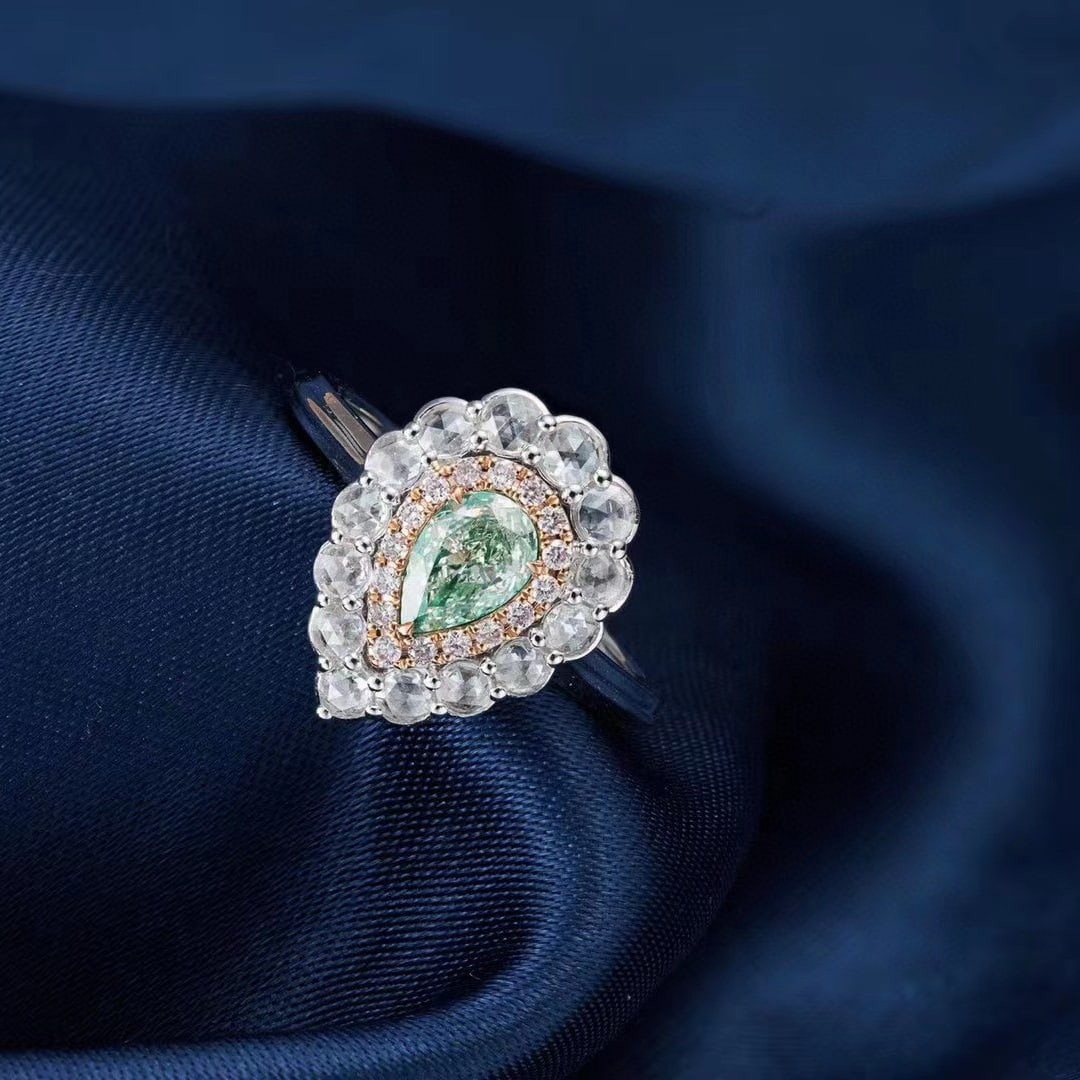 14k Gold 0.99 Ctw Natural Green Diamond & Diamond Ring: Ref:230996227 // gold content:14k gold // ring size:7. 25us // // main gemstone:green diamond // shape:pear // carat weight:0. 52ct // color:green // treatment:natural // // adjacent gemstone 2 :